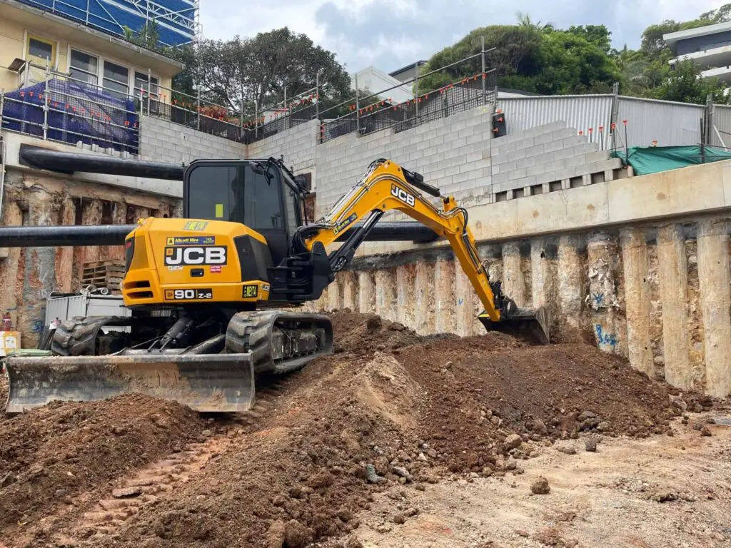 230312 Excavator on residential building site digging the basement 1