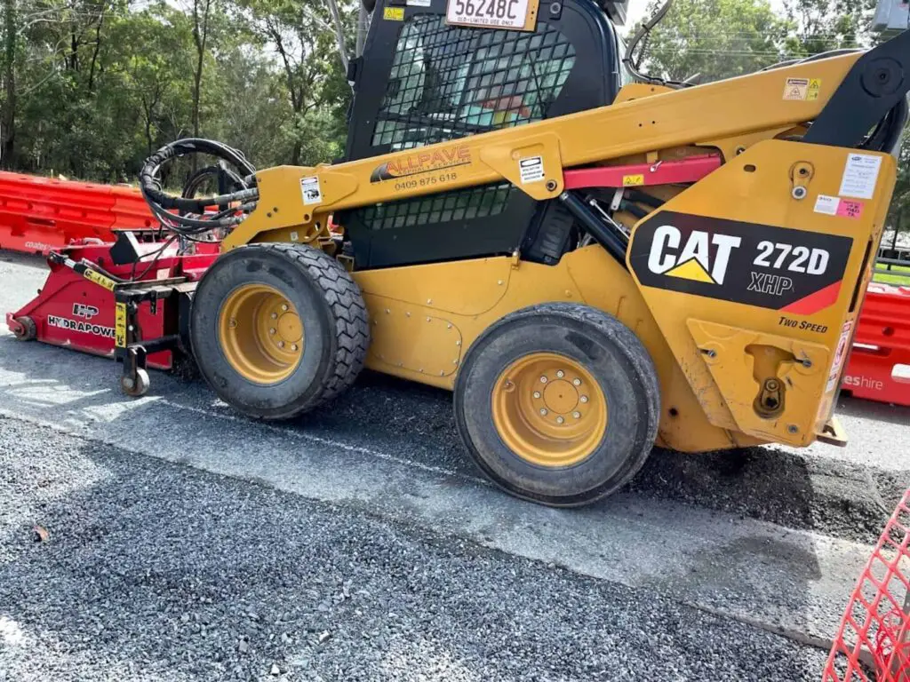 230312 Skid steer with a cold planner on road construction project 1