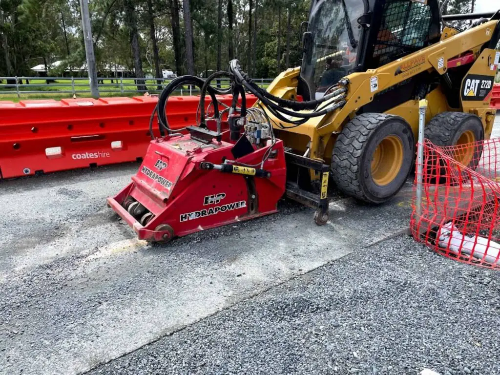 230312 Skid steer with a cold planner 1