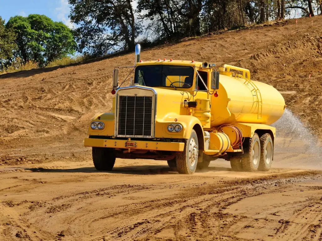 230316 Water truck supressing dust with water