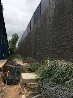 230419 Monitoring prisms being placed and measured on retaining wall